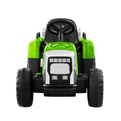 Toy tractor with green and black design on a white background