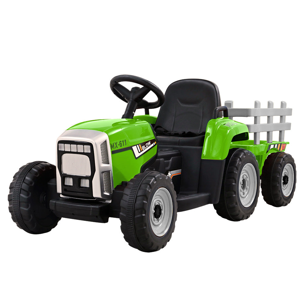 Green toy tractor with black seat and trailer on a white background