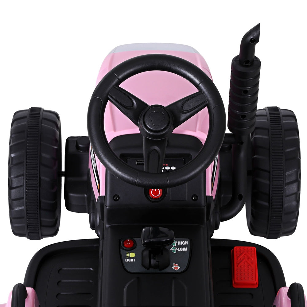 Pink toy car with steering wheel and controls on a white background
