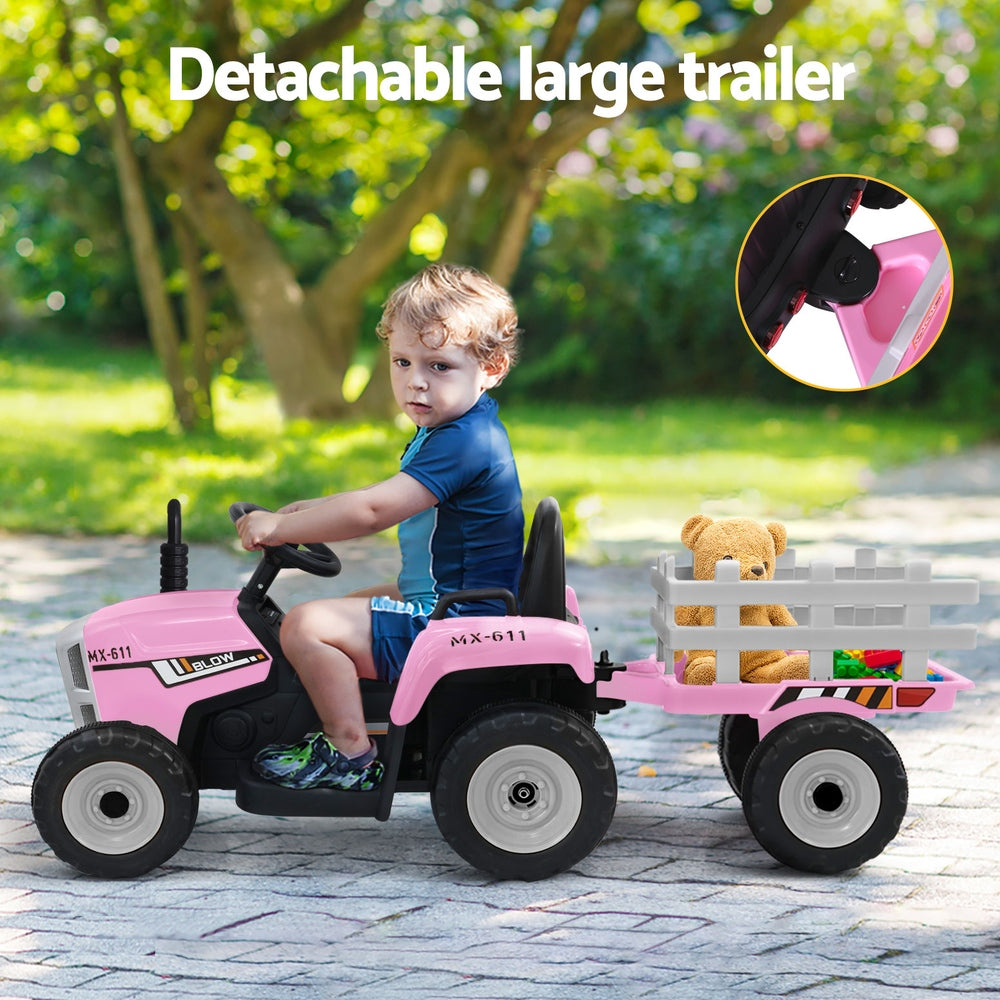 Child playing with a pink toy tractor with a detachable trailer in an outdoor setting.