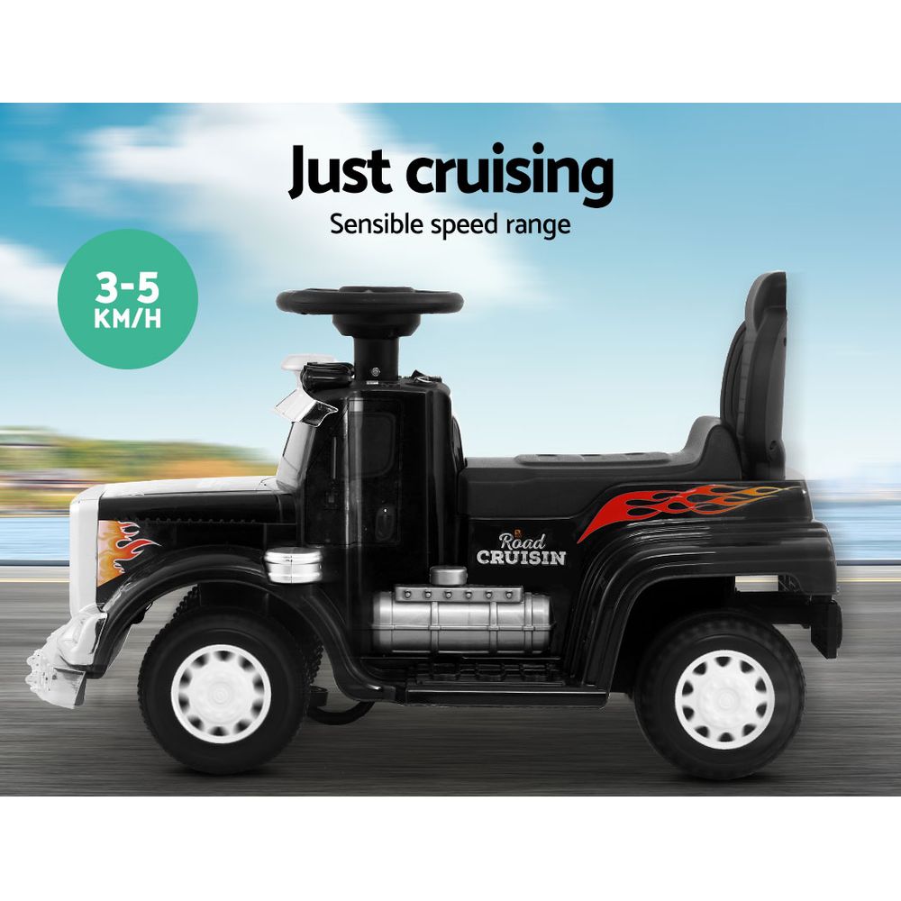Black toy car with 'Just cruising' text and speed range indicator on a blurred road background.