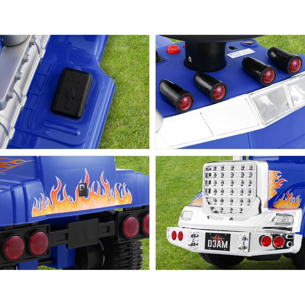 Close-up details of a blue toy truck with flame design on grass