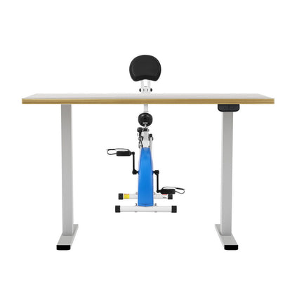 Exercise bike attached to a standing desk on a white background