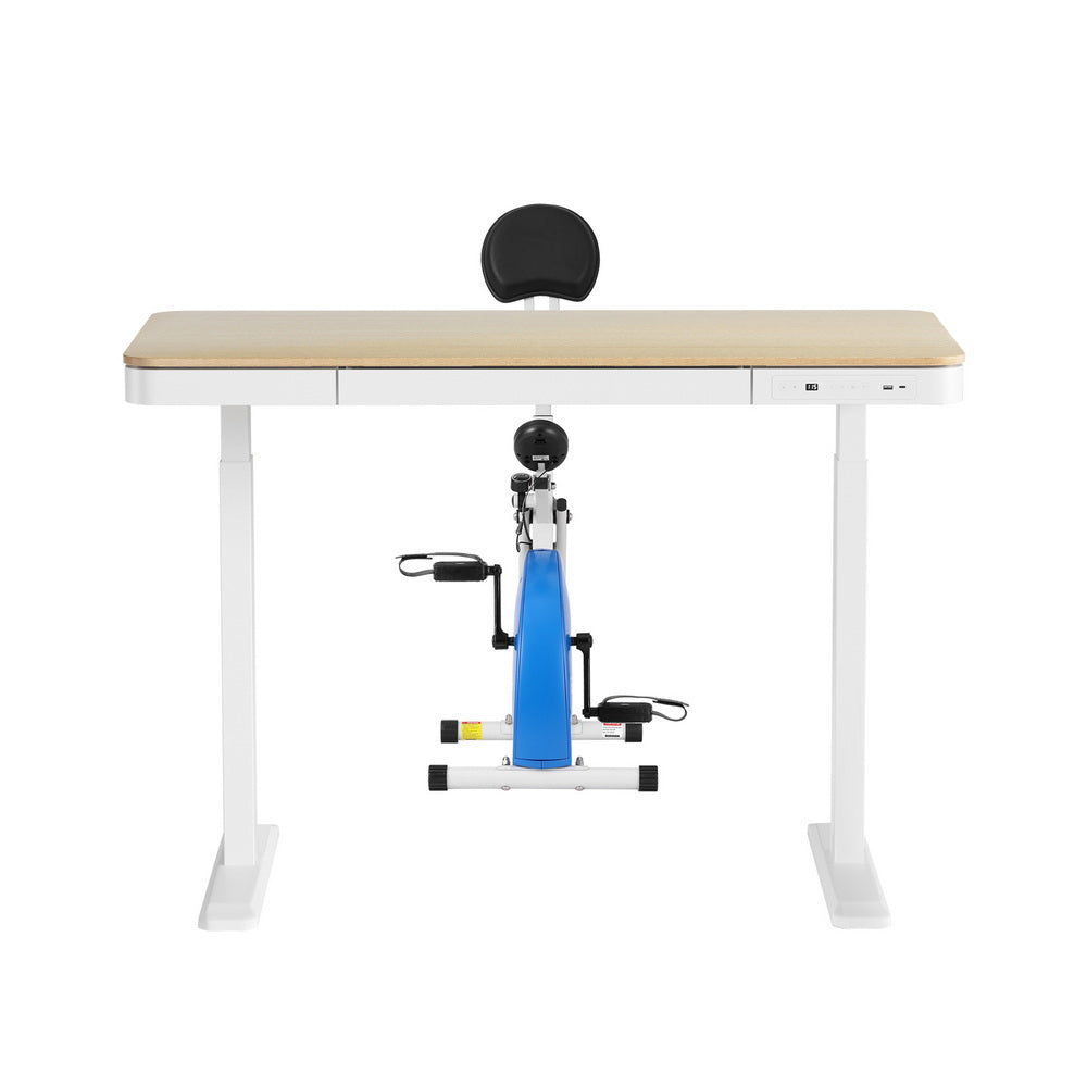 Ergonomic desk with built-in exercise bike on a white background