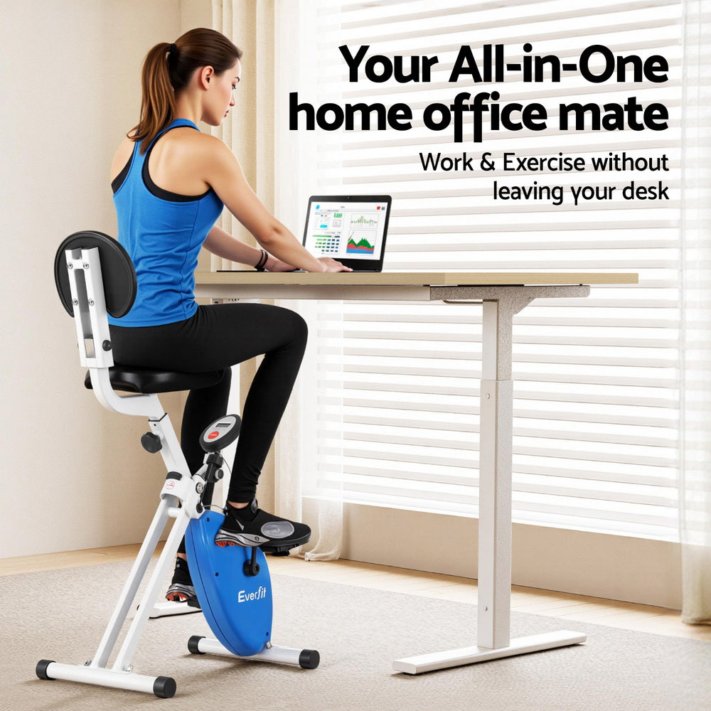 Woman using a stationary bike desk in a home office setting.