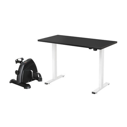 Electric Standing Desk with Exercise Bike-Desk with white legs and a black exercise bike on a white background