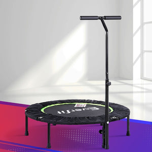 A green and black Everfit fitness trampoline with a foldable handrail, placed on a pink and purple mat.