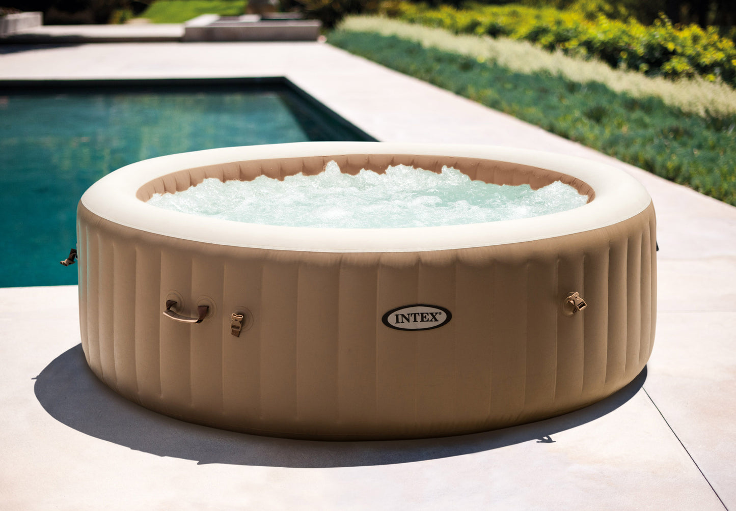 Inflatable hot tub with water in a garden setting
