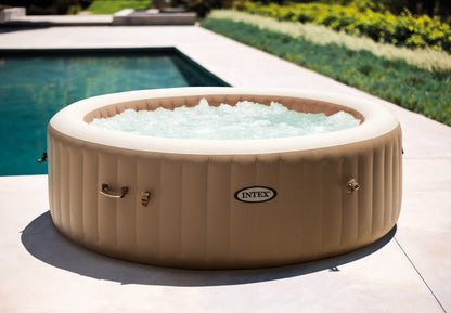 Inflatable hot tub with water in a garden setting