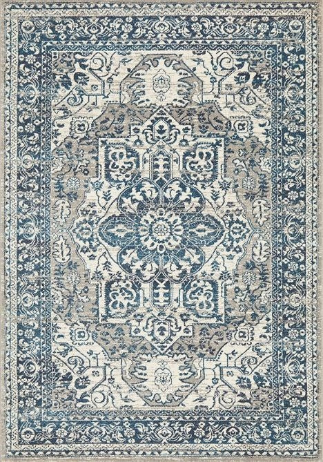 A rectangular blue and beige floral pattern area rug.