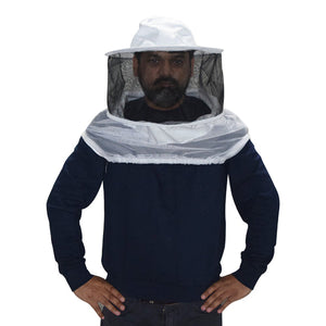 Person wearing a beekeeping suit with a white hat and face mask on a white background