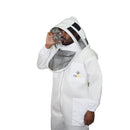 Person wearing a white beekeeping suit with a hood.