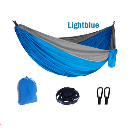 A light blue and gray outdoor camping hammock with its carrying storage bag, displayed on a white background.