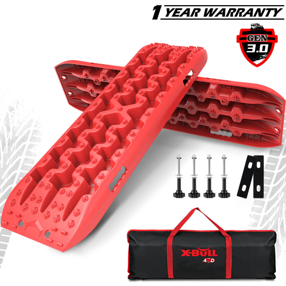X-BULL recovery tracks in red color with mounting hardware, displayed alongside a black carrying tote with the X-BULL logo.