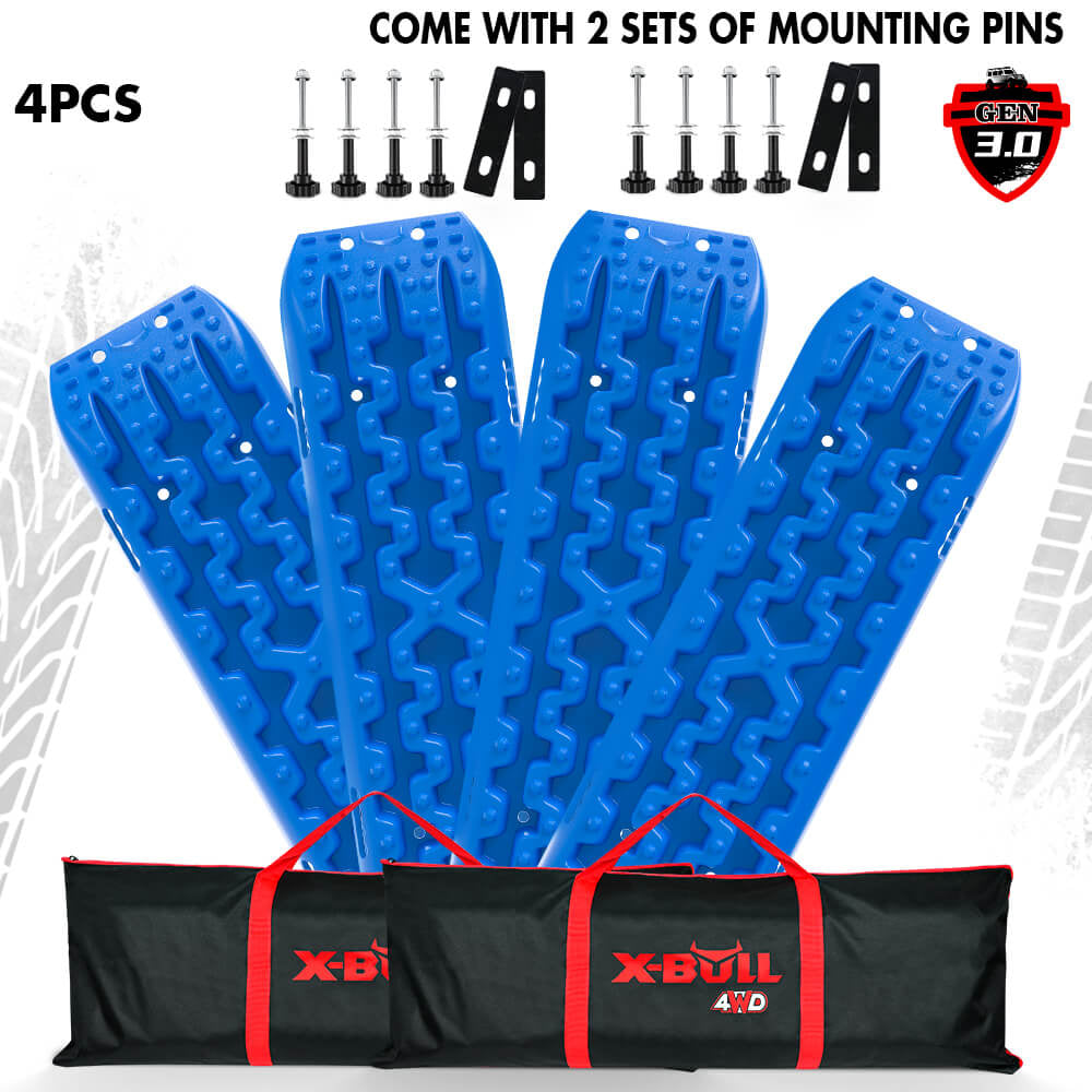 A set of blue recovery tracks with mounting bolts and a black and red carrying tote, labeled X-BULL.
