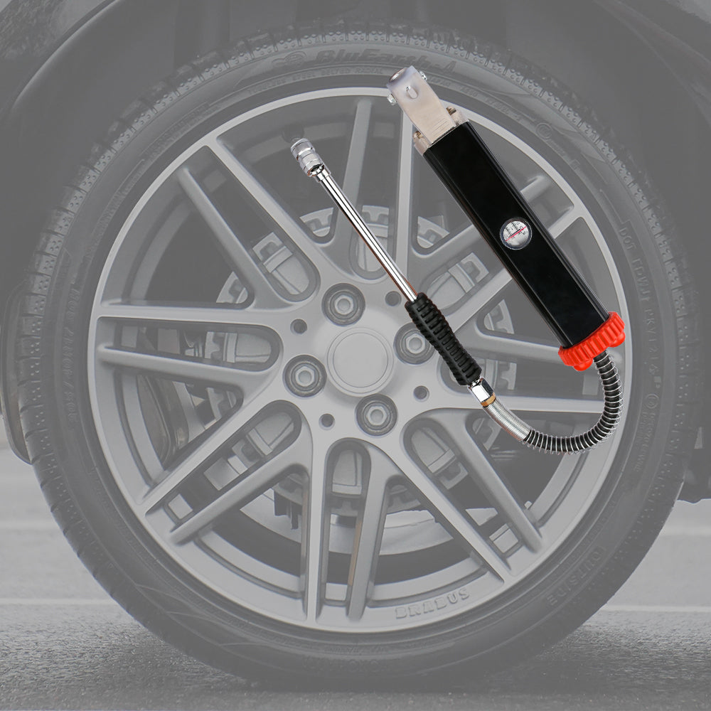 Tire inflator with hose attached to a car tire on a gray background