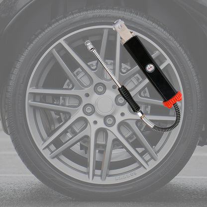 Tire inflator with hose attached to a car tire on a gray background