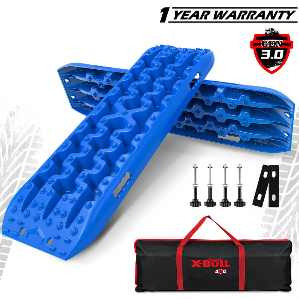 A set of blue recovery tracks labeled X-BULL with various components including mounting pins, leashes, and a carry bag.