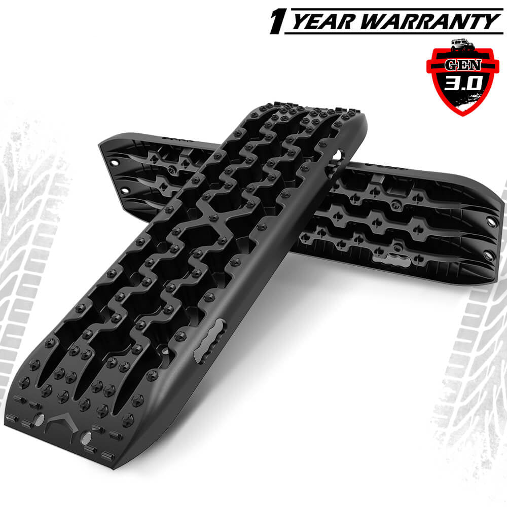 Two black X-BULL recovery tracks laid out on a white background, showcasing their texture and design details.