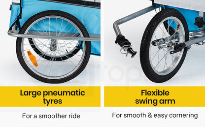Close-up of bicycle trailer wheels with text on large pneumatic tires and flexible swing arm.