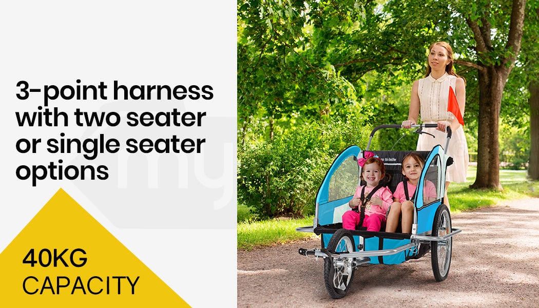 Child trailer with 3-point harness, capacity 40KG, and options for two or single seater, with a woman and children in a park.