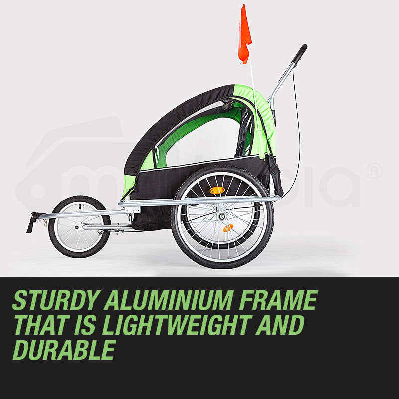 Green and black bike trailer with a white background and text about its frame quality.