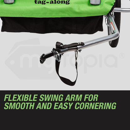 Green tag-along stroller with a flexible swing arm on a gray background