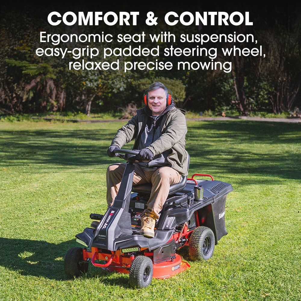 Man operating a riding lawn mower with text highlighting comfort and control features.