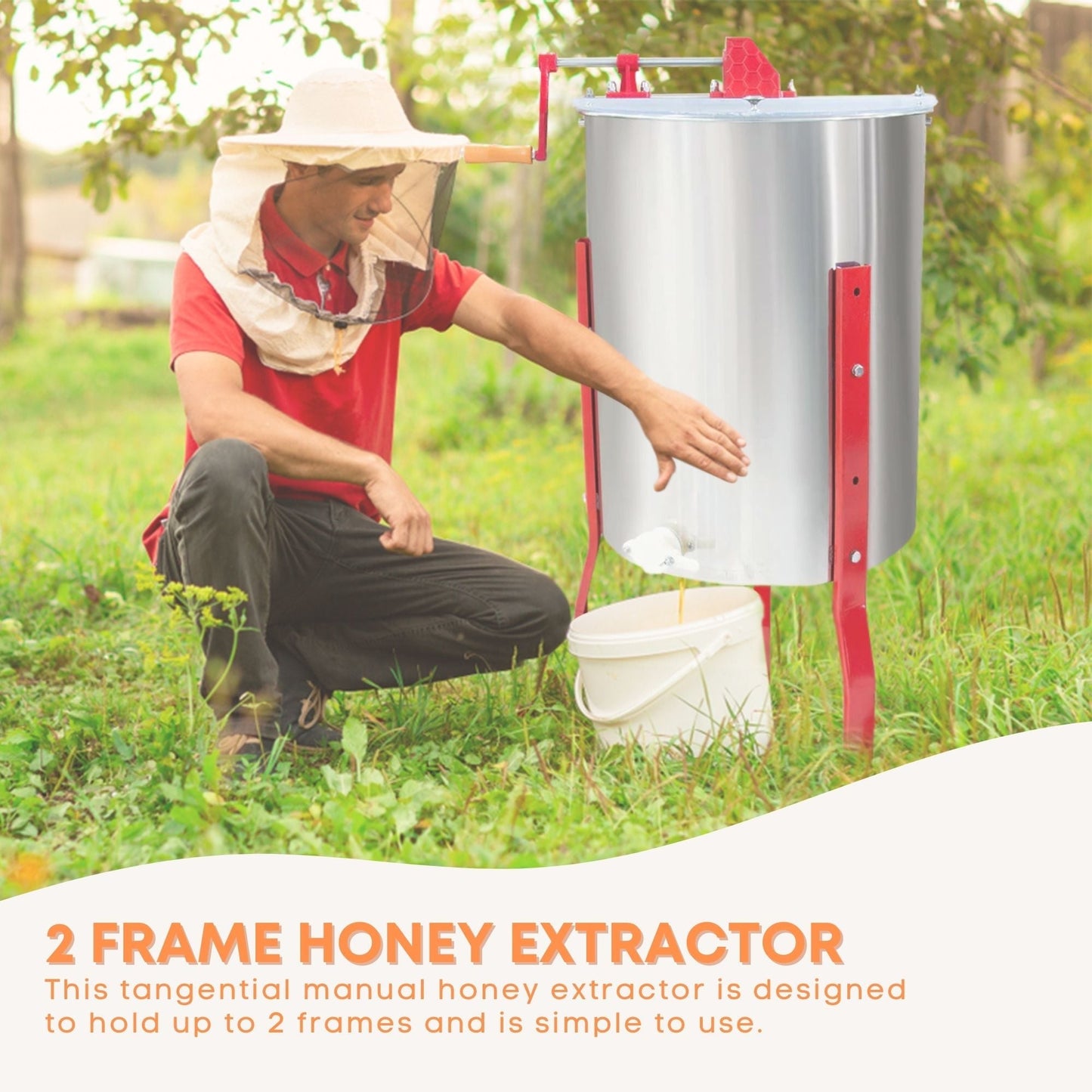 Person using a 2 frame honey extractor in a natural setting