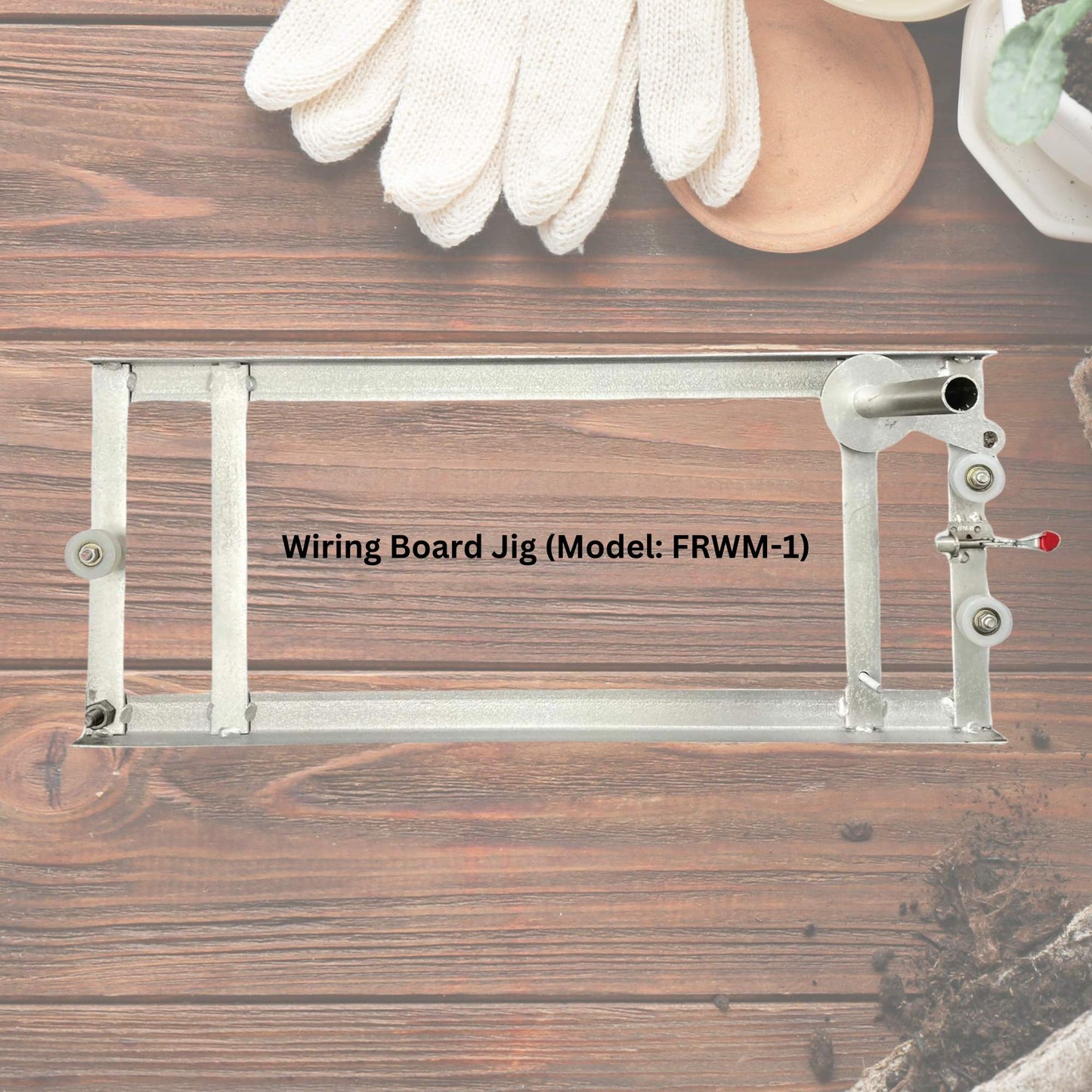 Wiring board jig with gloves and tools on a wooden background