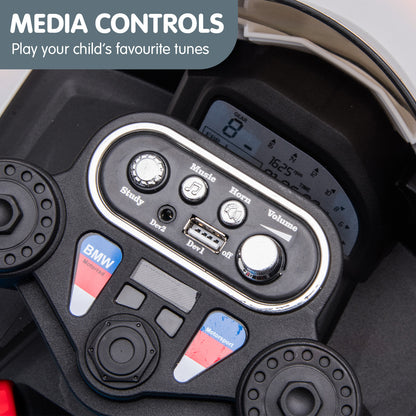 Media control panel with BMW logo on a vehicle dashboard