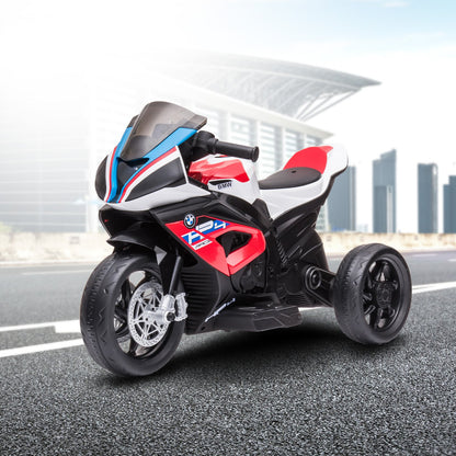 Children's toy motorcycle with BMW branding on a road.