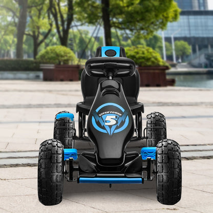Children's electric go-kart with 'Super Power 5' branding on a paved area with trees and buildings in the background.