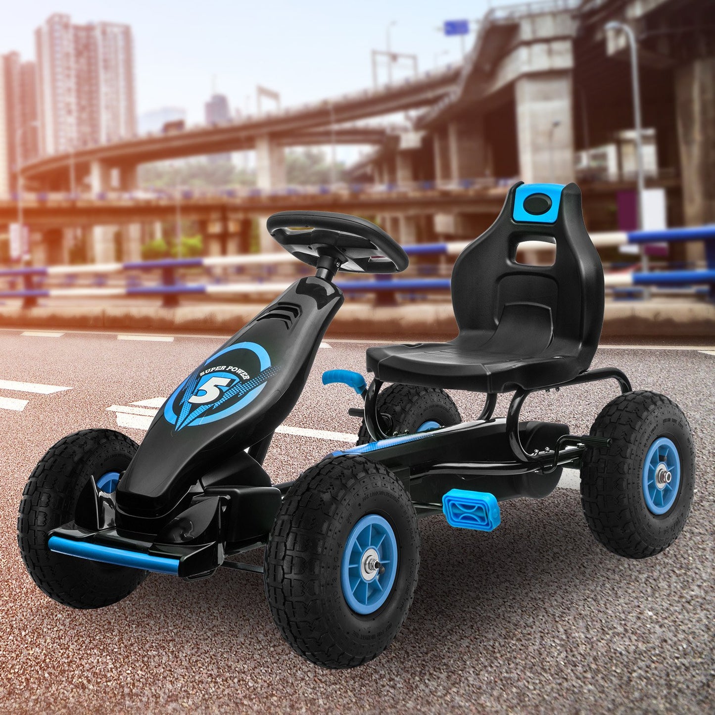 Black and blue go-kart on a road with a blurred cityscape background