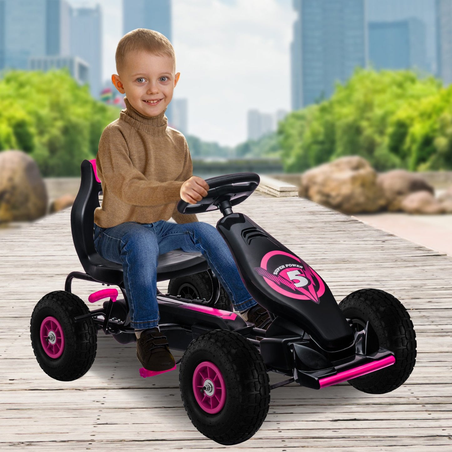 Child sitting on a black and pink go-kart with a cityscape background