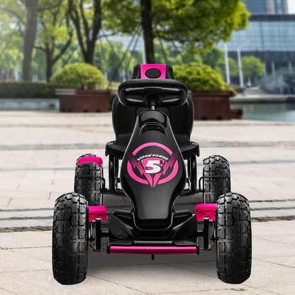 Black and pink toy car on a sidewalk with trees and buildings in the background