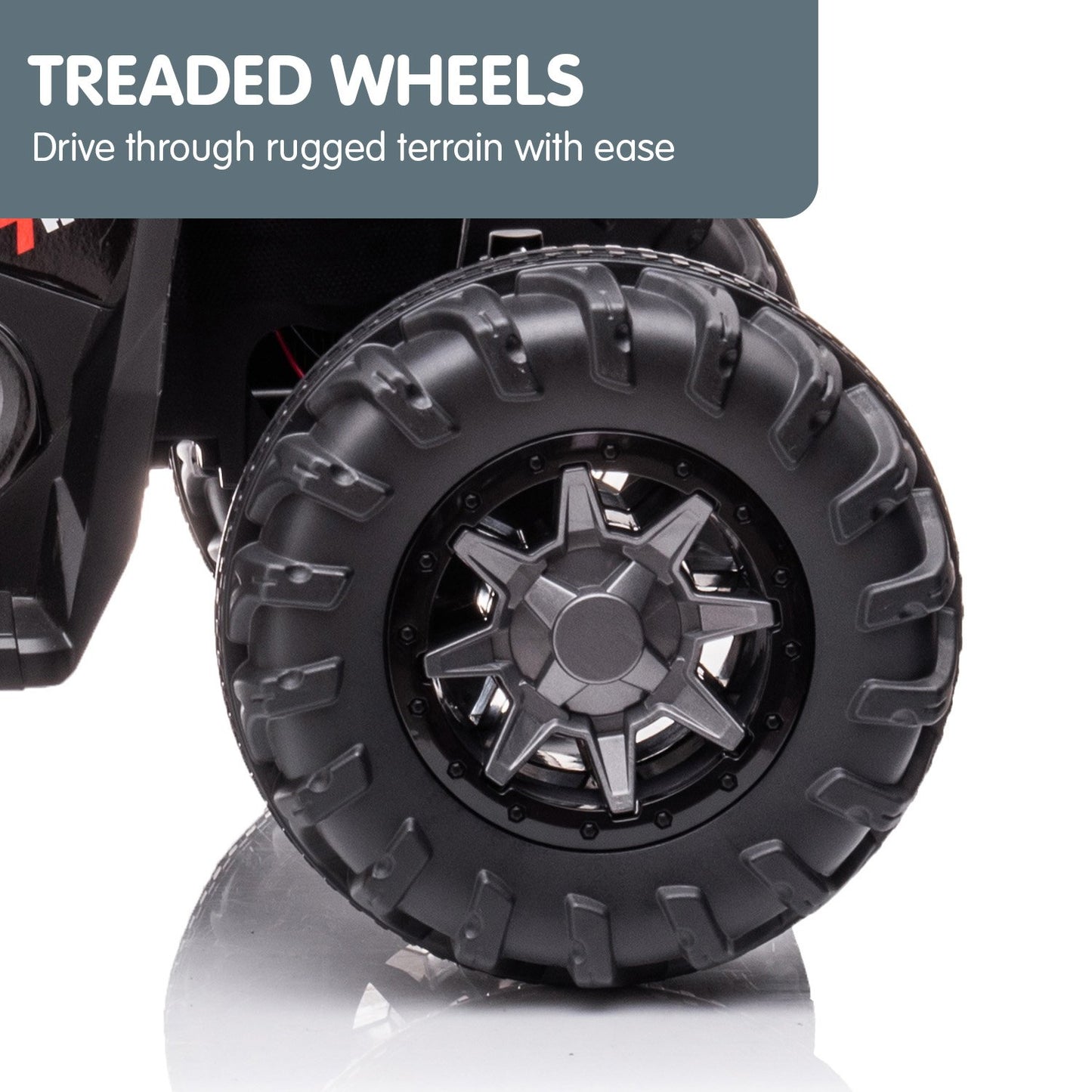 Close-up of a black treaded wheel with text about rugged terrain capability on a white background.