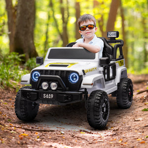 Child in sunglasses sitting in a toy truck in a forest setting