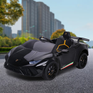 Black toy sports car on a road with buildings in the background