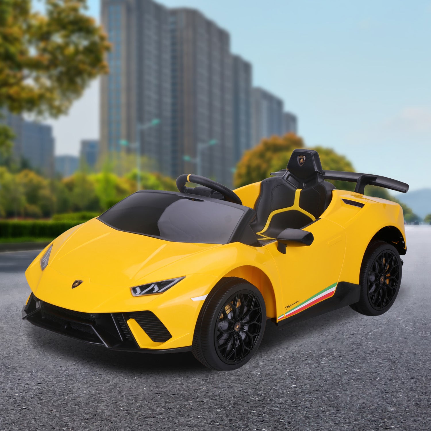 Yellow toy car with black details on a road with buildings in the background