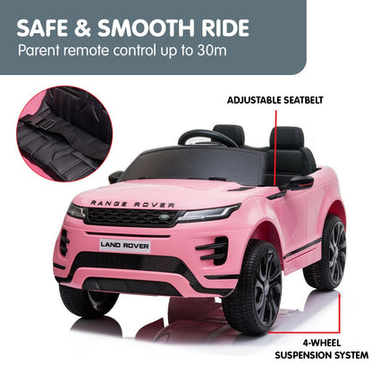 Pink toy car with Range Rover branding, featuring adjustable seatbelt and 4-wheel suspension system on a white background.