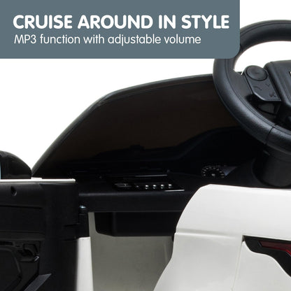 Car interior with steering wheel and dashboard, featuring text about MP3 function and adjustable volume.