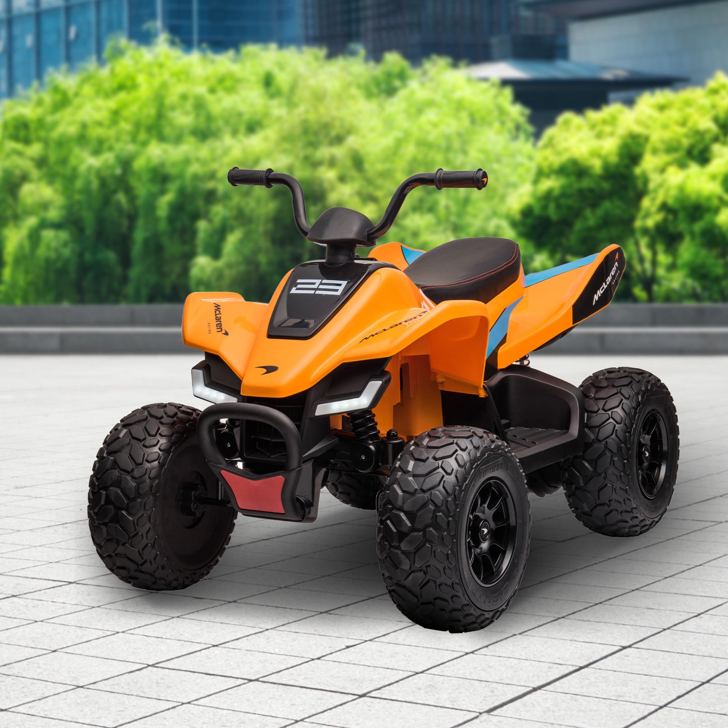 Orange toy ATV on a tiled floor with greenery in the background