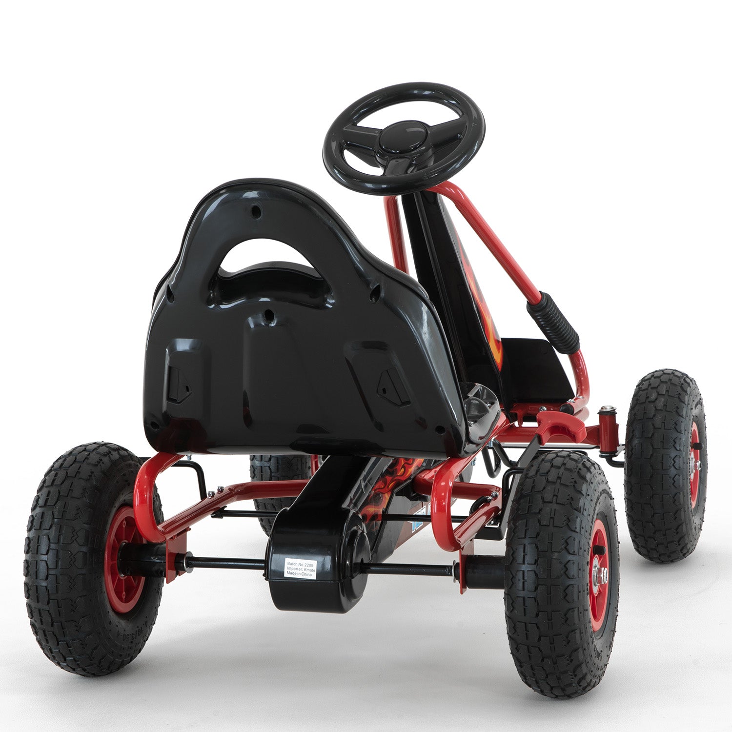 Black and red pedal go-kart on a white background