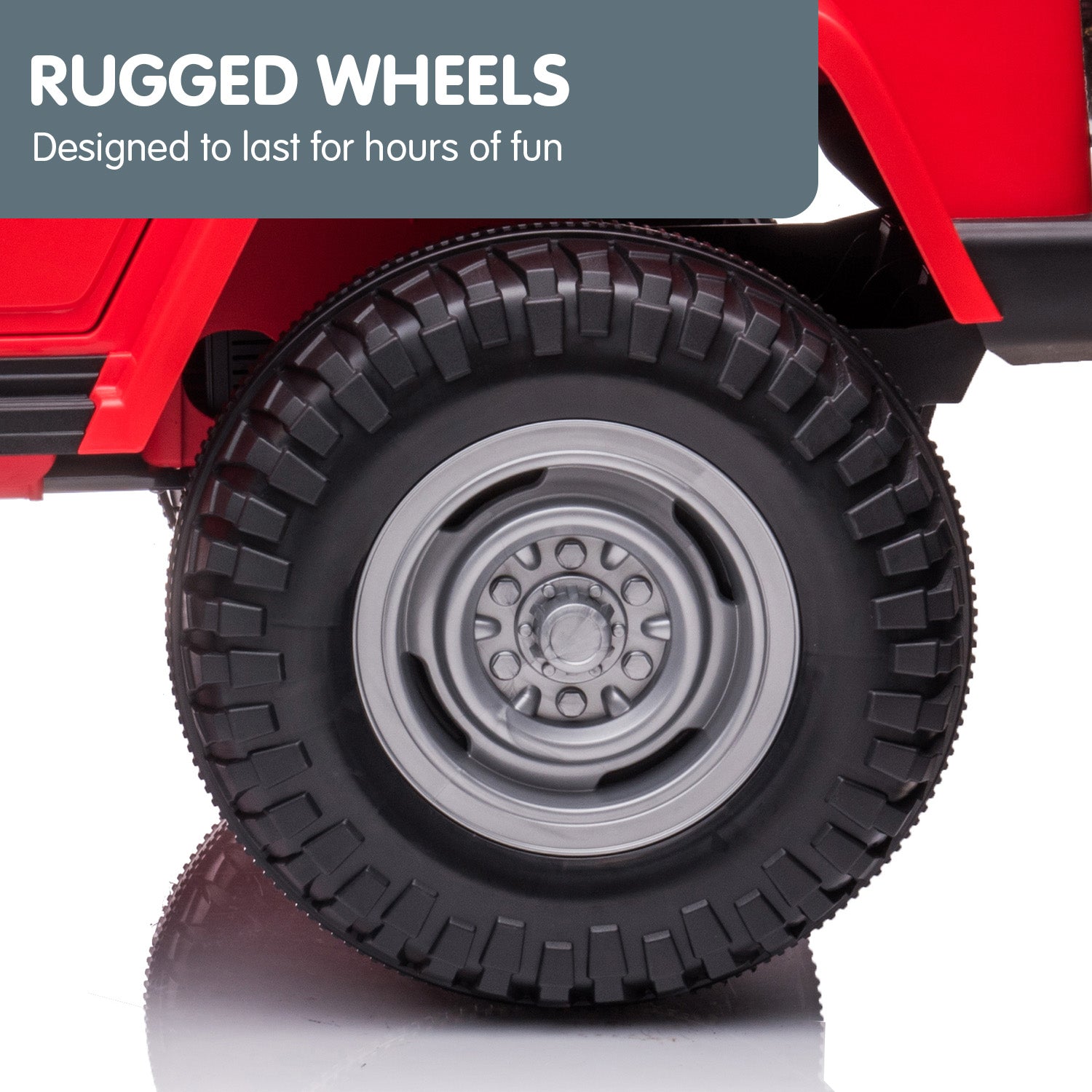 Close-up of a red toy truck with a rugged black tire on a white background, featuring text 'Rugged Wheels' and 'Designed to last for hours of fun'.