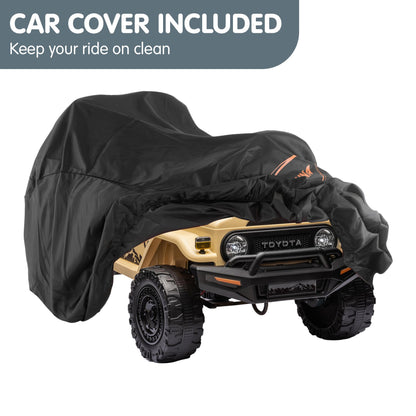 Toy Toyota vehicle covered with a black car cover on a white background.