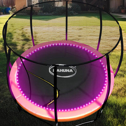 Trampoline with LED lights on a grassy area