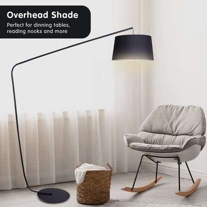 Modern floor lamp with black shade in a living room setting.