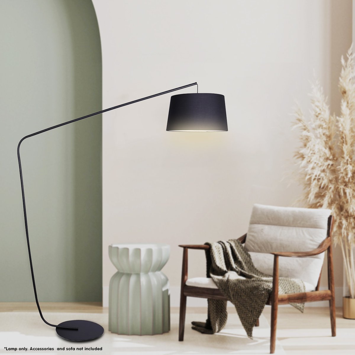 Modern floor lamp with black shade in a minimalistic room with a chair and decorative elements.