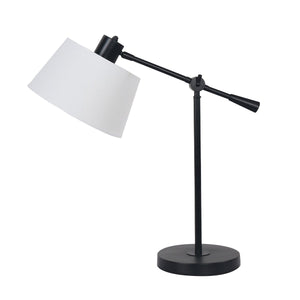 An adjustable metal table lamp with a black finish and a white linen fabric shade, with an arm that swings for directional lighting.